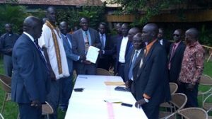 Representatives of the Yei government and the opposition group during the signing of the peace deal in Kampala on May 31, 2017. (Radio Tamazuj)